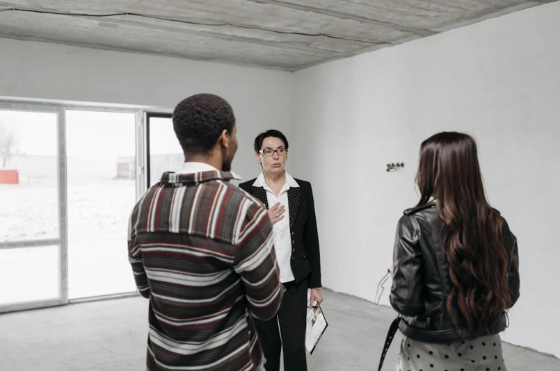 A family discussing relocation plans with a realtor