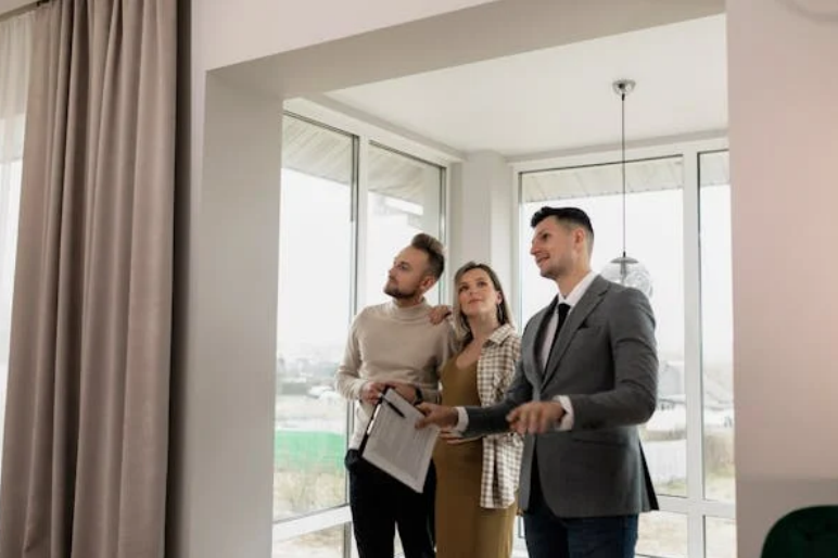 A realtor showing a property to potential buyers